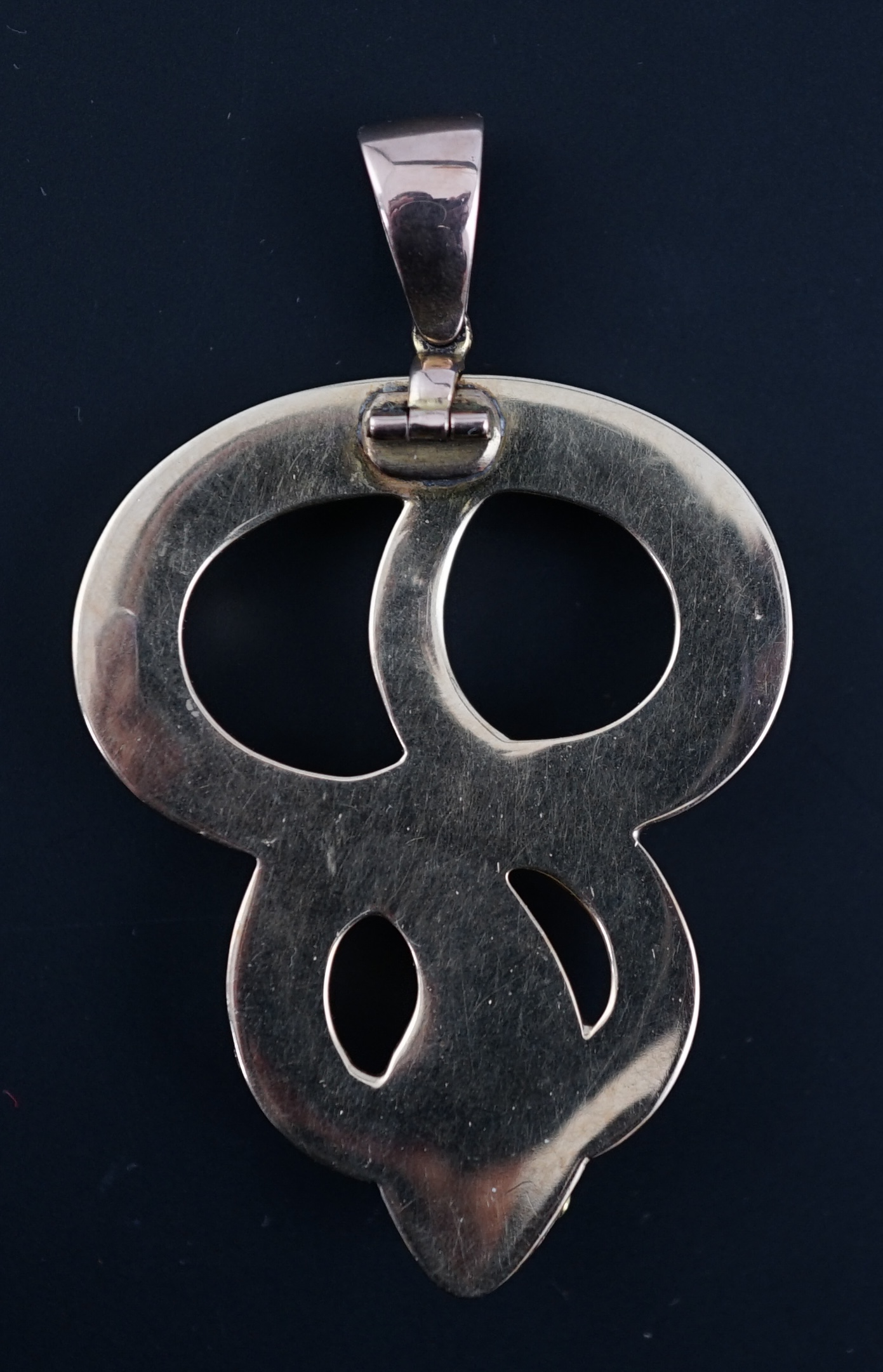 A Victorian gold, turquoise and cabochon garnet set entwined serpent pendant